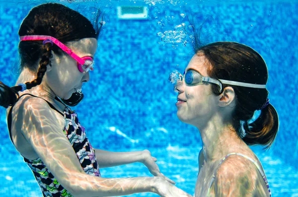 Young kids playing underwater tea party is a fun game and one of the best pool games for kids. 
