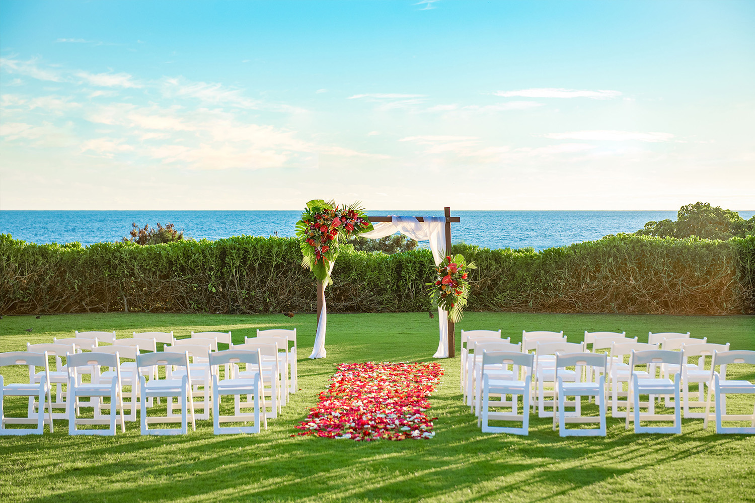 Beach ceremony location prepared by our wedding planner. A beautiful view of the beach is one of the features of destination weddings.