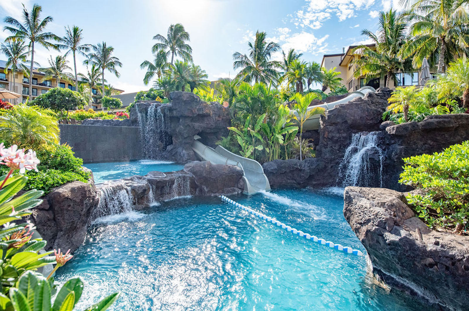 A thrilling waterslide through lava rock with waterfalls at a top-rated USA pool