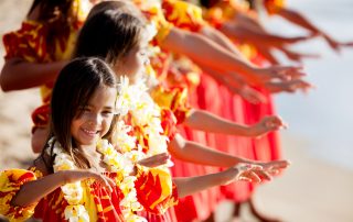 Young Hula dancer leads the troupe Koloa landing resort weekly activities the troupe