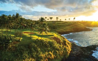 Panoramic view of one of the top Kauai golf courses, with lush greens surrounded by expansive oceanic vistas